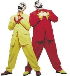 two men in clown costumes standing next to each other with their hands on their hips