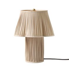 a lamp that is made out of pleated material and has a cord attached to it