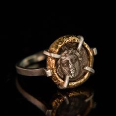 This Relic style ring features an ancient coin circa 250-190 BC. The coin is from the Pisidia region which is located in modern-day southern Turkey. This coin depicts the helmeted head of Athena, the goddess of wisdom, war and the crafts. For the warrior in you or in your life, this ring is a powerful talisman. Our Relic styles are handcrafted using traditional sandcasting techniques. The bezel surrounding this coin was formed from wax that was used to create a mold in sand. Molten gold was pour Spiritual Brass Coin Jewelry, Traditional Ritual Coin Pendant Jewelry, Spiritual Gold-plated Coin Jewelry, Spiritual Antique Silver Coin Pendant Jewelry, Traditional Coin-shaped Metal Jewelry, Coin Ring, Ancient Coins, Bespoke Jewellery, Jewelry Repair