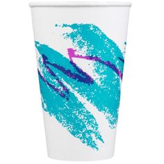 a white cup with blue and pink designs on it's side, in front of a white background