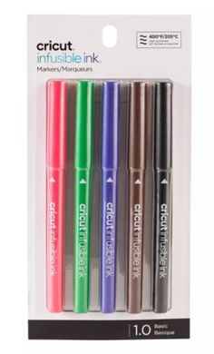 four different colored pens in a package