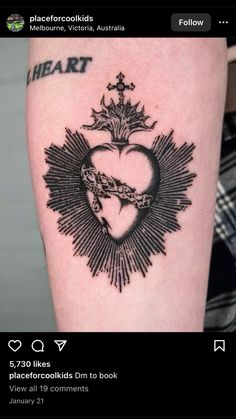 a black and white photo of a heart tattoo