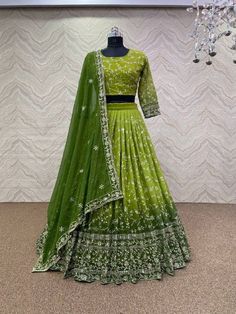 This Green Two Tone Georgette Lehenga Choli and Dupatta ensemble exudes elegance and charm with its exquisite embroidery work. Crafted from high-quality georgette fabric, the lehenga features a mesmerizing two-tone effect in shades of green, adding depth and dimension to the attire. New Lehenga Choli, New Lehenga, Fancy Embroidery, Lehenga Choli Designs, Cotton Lehenga, Georgette Lehenga