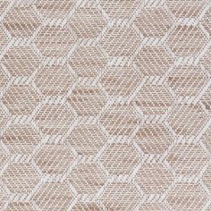 an upholstered fabric with white and brown geometric designs on it's surface