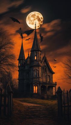 a spooky house with bats flying over it at night