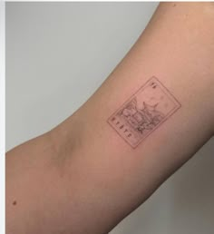 a person with a small tattoo on their arm