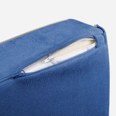 a blue piece of cloth with zippers on it