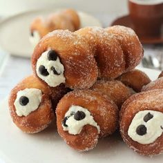 several doughnuts are stacked on top of each other with cream cheese in the middle