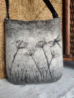 a handmade bag with flowers drawn on it