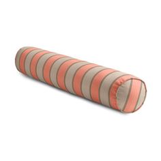 an orange and beige striped pillow on a white background with the bottom half rolled up