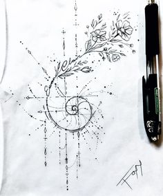 a pen and ink drawing on paper with an image of a flower in the center