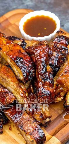 bbq ribs and barbecue sauce on a cutting board