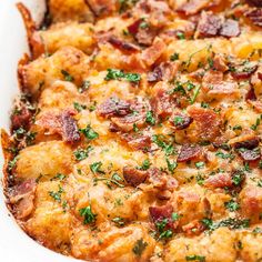 a casserole dish with bacon, cheese and parsley in it on a white plate