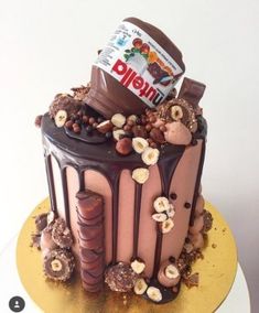 there is a cake that has chocolate and nuts on it