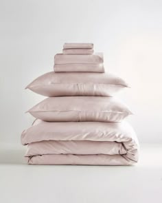 a stack of pillows sitting on top of each other