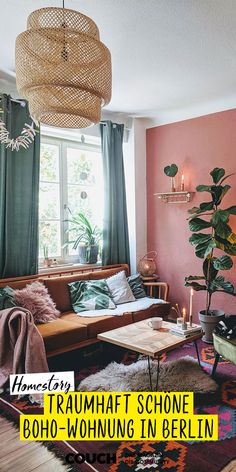 a living room filled with furniture and plants