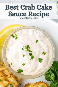 the best crab cake sauce recipe is in a small bowl with lemon wedges and parsley