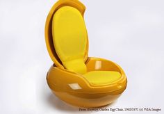 an orange chair with a yellow seat on it's back and its lid open