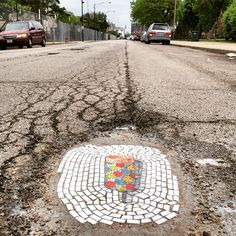 a street with a mosaic design painted on it