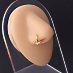 ✦ Adorn your look with our exclusive collection of 18k gold-plated dangle Hoop Nose Rings, shining in both classic silver and luxurious gold finishes. Our meticulously crafted assortment includes a variety of designs to match every mood and style: elegant Heart nose ring, whimsical Wing nose ring, celestial Moon nose ring, symbolic Cross nose ring, blooming Flower nose ring, radiant Star nose ring, delicate Feather nose ring, regal Crown nose ring, and more. Ideal for those who value sophisticat Modern Small Hoop Gold Piercings, Modern Gold Small Hoop Piercings, Gold Diamond Hoop Piercings, Diamond Hoop Piercings For Gifts, Diamond Hoop Piercings As Gift, Gold Huggie Piercings With Diamond Accents, Diamond Hoop Piercings, Elegant Hoop Septum Ring For Anniversary, Gold Cubic Zirconia Piercings Fine Jewelry