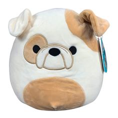 a close up of a stuffed animal with a tag on it's ear and nose