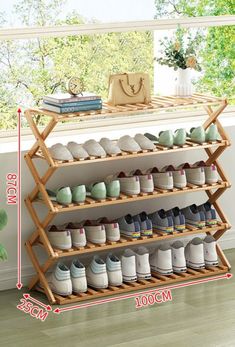 the shoe rack is holding many pairs of shoes and has two levels to hold them