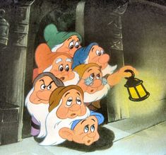 the seven dwarfs from snow white and the seven dwarfs are looking at an old fashioned lantern