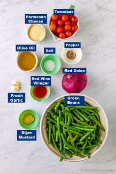 the ingredients for green beans are shown in bowls on a white counter top with blue labels