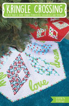 the front cover of a quilt book, featuring an image of a christmas tree with presents on it