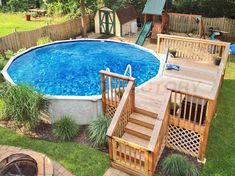 an above ground pool with steps leading up to the deck and stairs down to it