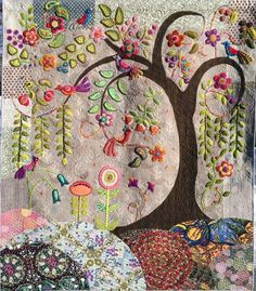 an appliqued tree with flowers and birds on it is featured in the quilter's website