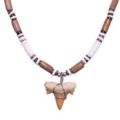 a necklace with an animal's head hanging from the front and two small beads on it