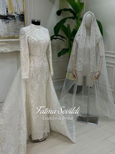 two mannequins dressed in wedding dresses and veils