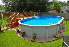 an above ground swimming pool in a backyard