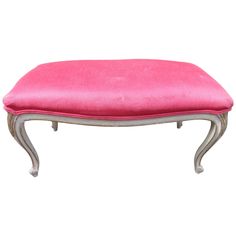 the foot stool is pink and silver