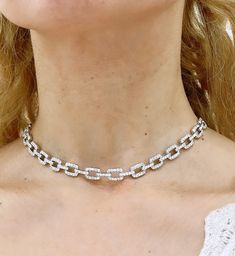 This stunning 4.50ct t.w. diamond link choker statement necklace will instantly elevate any look. Showcasing exquisite diamond brilliance and timeless style, it's sure to be the perfect addition to your finejewelry collection. Sparkling and sophisticated, you'll look and feel like a million bucks! Metal: 18K White GoldDiamond Shape: Round Brilliant-cuts Diamond Weight: 250 Round brilliant cut 4.50ct tw Dimensions: 8mm wideLenght: 40cm Statement Choker Necklace, Round Brilliant Cut Diamond, Brilliant Cut Diamond, Round Brilliant, Timeless Style, Feel Like, Timeless Fashion, Diamond Cuts, Choker