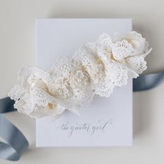 Lace lovers unite! Brides who are head over heels for all things lace with a dreamy, romantic bridal style vibe, look no further! Our 'In The Mood For Lace' style wedding garter is the perfect bridal accessory and wedding heirloom to lace, oops, we mean love, forever. Details Production Shipping Sizing Main Garter: Light ivory satin background with two layers of scalloped ivory luxury lace and detailed with a set of three ivory mini flowers with a pearl in the center of each flower (approx. 3 in Satin Background, Wedding Garter Lace, Mini Flowers, Bridal Accessory, Heirloom Wedding, Wedding Kiss, Perfect Bride, Shimmer Shine, Light Ivory