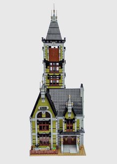 a lego model of a house with a clock tower