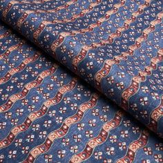 a blue and red patterned fabric with an intricate design on the front, in full view