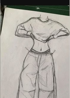 a drawing of a woman's shirt and pants with her hands on her hips