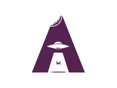 an alien letter logo with a spaceship flying over it