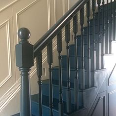 an image of a staircase with blue steps and railings in the house or apartment