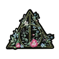 a patch with flowers on it and a letter in the shape of a flowered triangle