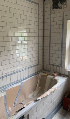 an old bathtub in the middle of being remodeled and remodeled with new tile