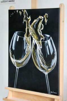 a painting of two wine glasses on a easel