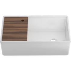 an image of a white sink with wooden counter top and drain hole in the middle