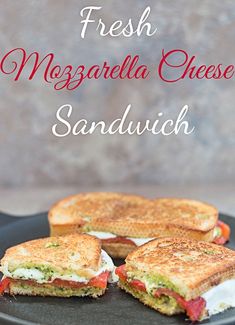 grilled mozzarella cheese sandwich on a black plate with the words fresh mozzarella cheese sandwich