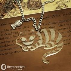 two necklaces that have been placed on top of an open book with the word love written