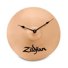 a clock that is on top of a cymbal with the word zilhan written