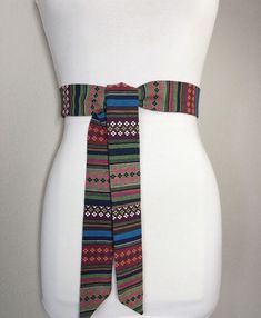 "Woven Ethnic Print Sash Aztec Sash, Tribal Sash Native American Belt, Festival Accessories Bohemian Waist Sash, Wrap Belt Satin Swank This Satin Swank® sash in a woven Aztec fabric provides an instant update to your denim or casual look. Depending on your waist size and the length you choose, you can wrap this sash around your waist once or twice. You decide whether to tie the sash in a bow or a simple knot with long-hanging tails. Tie in front, in back, or on the side. Yarn-dyed cotton twill f Aztec Fabric, Native American Patterns, Waist Sash, Bohemian Accessories, Wrap Belt, Festival Accessories, Ethnic Print, Ethnic Patterns, Suspender Belt